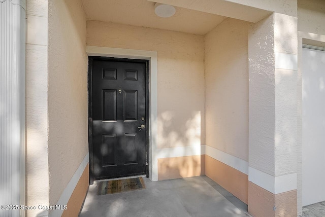 2416 57th Cir, Vero Beach, FL 32966 - view of exterior entry featuring stucco siding