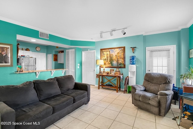 2416 57th Cir, Vero Beach, FL 32966 - living area with light tile patterned floors, ornamental molding, and track lighting