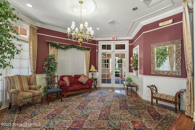 2416 57th Cir, Vero Beach, FL 32966 - living area with wood finished floors, french doors, a chandelier, ornamental molding, and recessed lighting