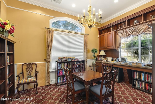 2416 57th Cir, Vero Beach, FL 32966 - carpeted dining room featuring a chandelier, wainscoting, ornamental molding, and plenty of natural light