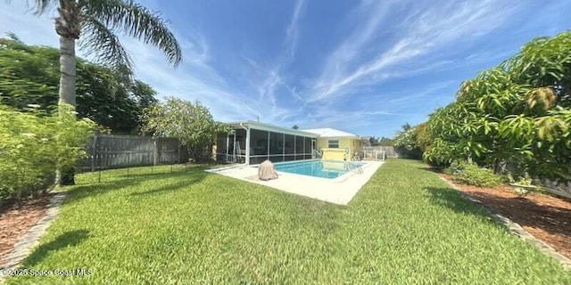 699 Bimini Rd, Satellite Beach, FL 32937 - rear view of property with a sunroom and a fenced backyard