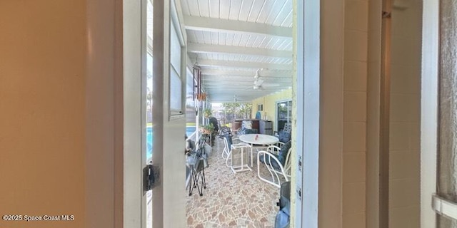 699 Bimini Rd, Satellite Beach, FL 32937 - sunroom featuring beamed ceiling