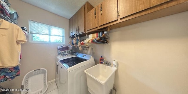 699 Bimini Rd, Satellite Beach, FL 32937 - laundry room featuring cabinet space and washing machine and dryer