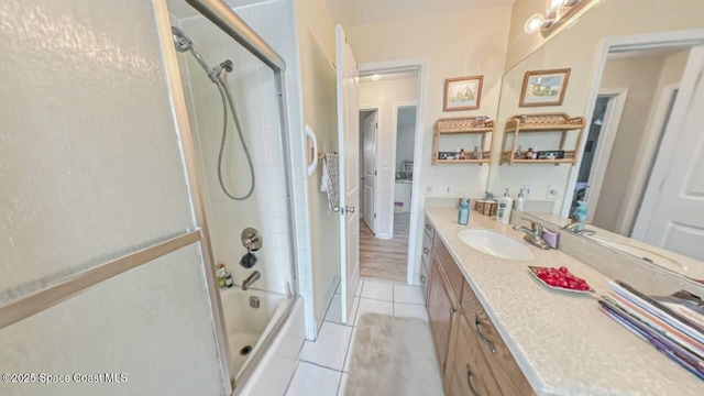 699 Bimini Rd, Satellite Beach, FL 32937 - full bathroom featuring tile patterned flooring, vanity, and bathing tub / shower combination