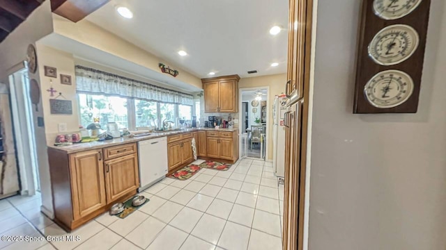 699 Bimini Rd, Satellite Beach, FL 32937 - kitchen featuring light countertops, white appliances, recessed lighting, light tile patterned flooring, and brown cabinetry