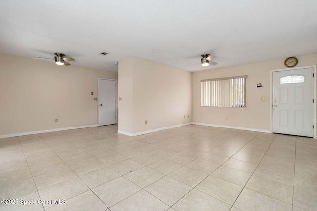 1572 Talavera St SE, Palm Bay, FL 32909 - unfurnished living room with a ceiling fan and light tile patterned flooring