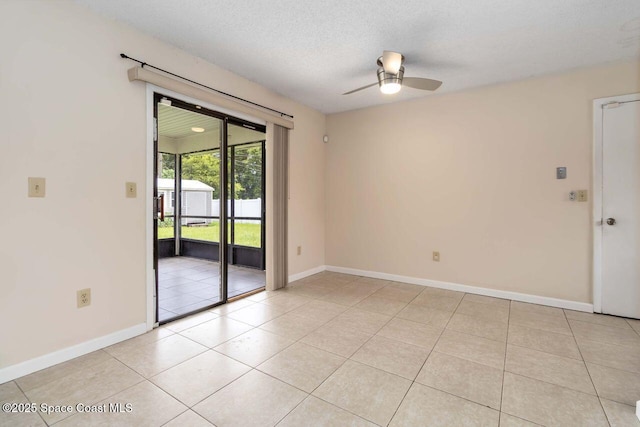 1572 Talavera St SE, Palm Bay, FL 32909 - spare room featuring ceiling fan, light tile patterned flooring, and a textured ceiling