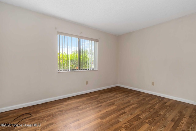 1572 Talavera St SE, Palm Bay, FL 32909 - spare room with wood finished floors and baseboards