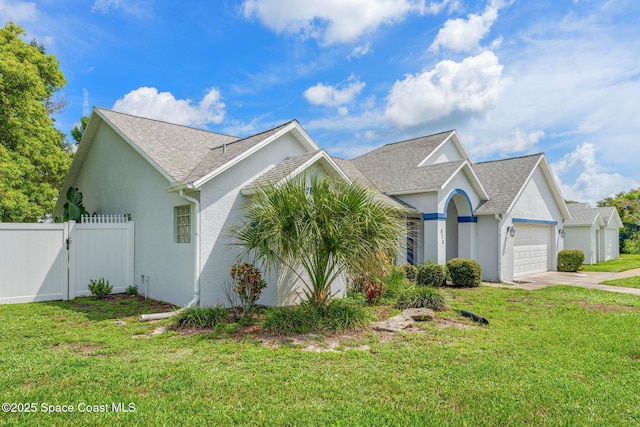 878 Croton Rd, Rockledge, FL 32955 - view of front of property with an attached garage, stucco siding, concrete driveway, and a gate