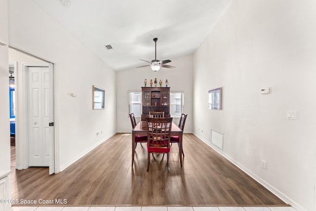 878 Croton Rd, Rockledge, FL 32955 - dining area with wood finished floors, ceiling fan, and vaulted ceiling