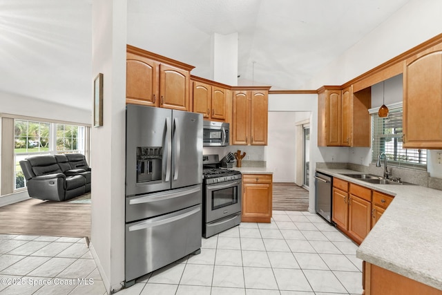 878 Croton Rd, Rockledge, FL 32955 - kitchen featuring appliances with stainless steel finishes, light tile patterned flooring, light countertops, plenty of natural light, and high vaulted ceiling