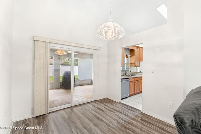 878 Croton Rd, Rockledge, FL 32955 - unfurnished dining area featuring a chandelier and light wood-style floors
