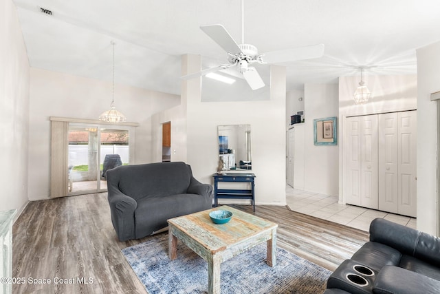 878 Croton Rd, Rockledge, FL 32955 - living room featuring high vaulted ceiling, ceiling fan, and light wood finished floors