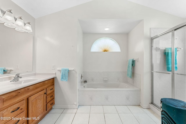 878 Croton Rd, Rockledge, FL 32955 - bathroom featuring tile patterned floors, vanity, a garden tub, and a shower stall