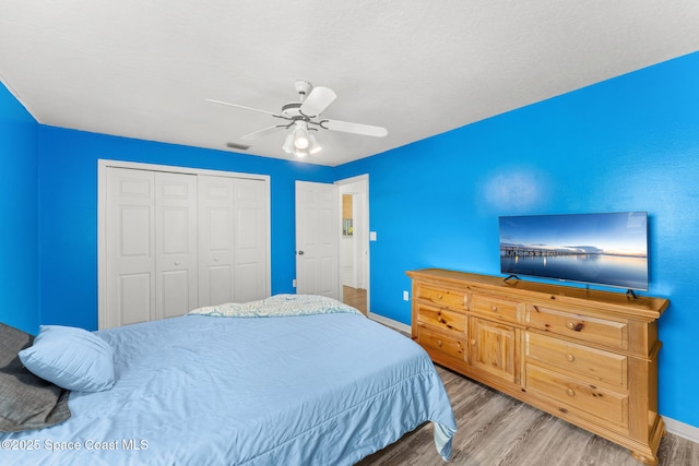 878 Croton Rd, Rockledge, FL 32955 - bedroom with wood finished floors, a closet, and ceiling fan