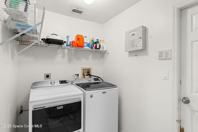 878 Croton Rd, Rockledge, FL 32955 - washroom with washing machine and dryer and a textured ceiling