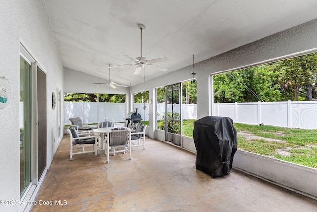 878 Croton Rd, Rockledge, FL 32955 - sunroom featuring outdoor dining area, ceiling fan, and vaulted ceiling