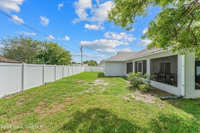 878 Croton Rd, Rockledge, FL 32955 - fenced backyard with a sunroom and a ceiling fan