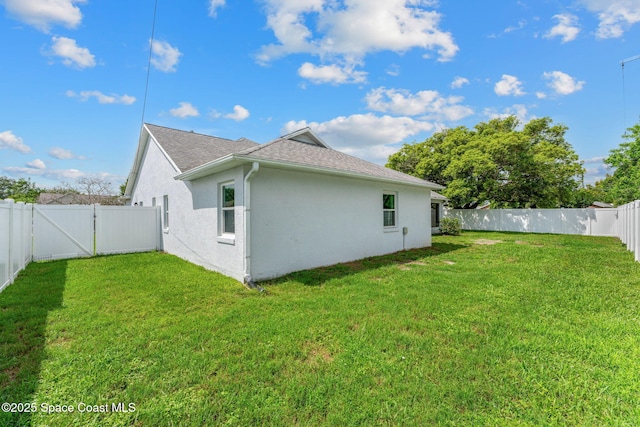 878 Croton Rd, Rockledge, FL 32955 - back of property featuring a fenced backyard, stucco siding, a gate, and roof with shingles