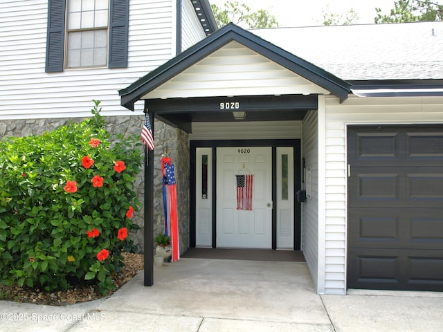 9020 York Ln Unit C, West Melbourne, FL 32904 - entrance to property featuring a garage and stone siding