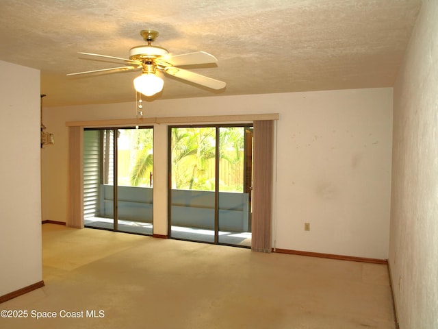 9020 York Ln Unit C, West Melbourne, FL 32904 - empty room with a ceiling fan and a textured ceiling