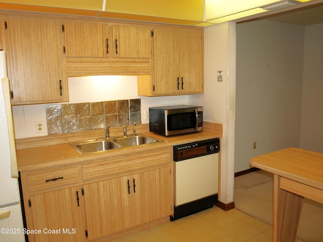 9020 York Ln Unit C, West Melbourne, FL 32904 - kitchen featuring white appliances, light countertops, decorative backsplash, and light brown cabinetry