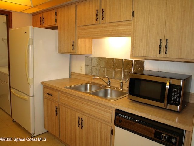 9020 York Ln Unit C, West Melbourne, FL 32904 - kitchen with white appliances, light countertops, decorative backsplash, and light tile patterned floors