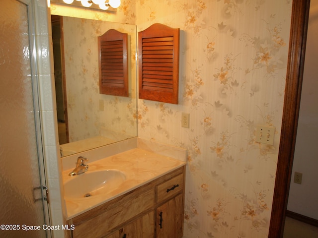 9020 York Ln Unit C, West Melbourne, FL 32904 - bathroom featuring vanity and wallpapered walls