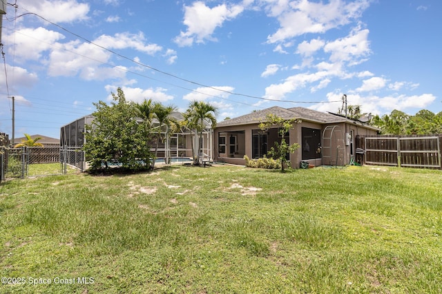 2606 Tepee Ave SE, Palm Bay, FL 32909 - fenced backyard with a gate, a pool, and a lanai