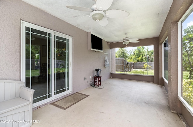 2606 Tepee Ave SE, Palm Bay, FL 32909 - unfurnished sunroom featuring ceiling fan and plenty of natural light