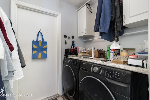 2606 Tepee Ave SE, Palm Bay, FL 32909 - laundry room featuring washing machine and dryer, cabinet space, and wood finished floors