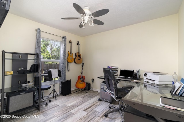 2606 Tepee Ave SE, Palm Bay, FL 32909 - home office featuring wood finished floors, ceiling fan, and a textured ceiling