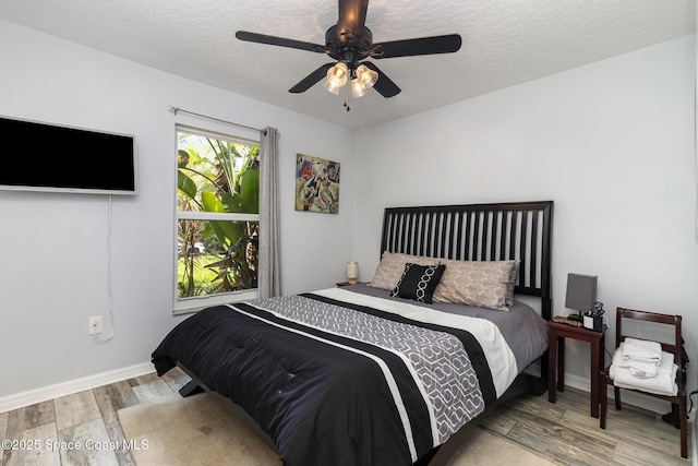 2606 Tepee Ave SE, Palm Bay, FL 32909 - bedroom with wood finished floors, a textured ceiling, and ceiling fan