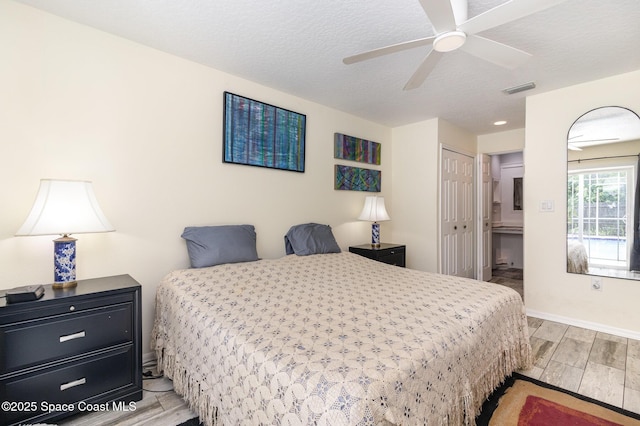 2606 Tepee Ave SE, Palm Bay, FL 32909 - bedroom featuring light wood-type flooring, a closet, and a ceiling fan