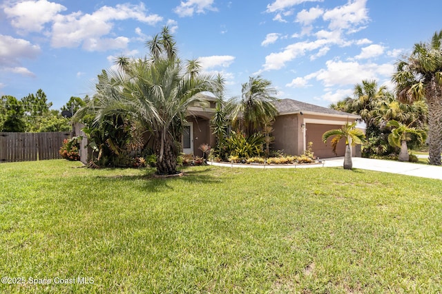 2606 Tepee Ave SE, Palm Bay, FL 32909 - obstructed view of property with stucco siding, a garage, and driveway