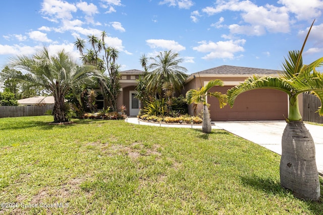 2606 Tepee Ave SE, Palm Bay, FL 32909 - view of front of house featuring driveway, an attached garage, and stucco siding