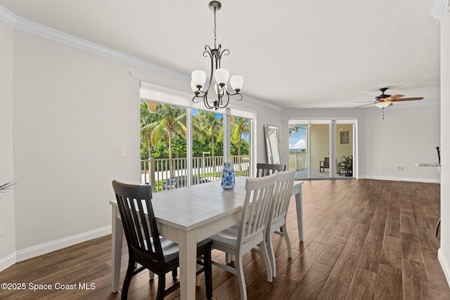 1 Eighth Ave Unit 1201, Indialantic, FL 32903 - dining area featuring crown molding, dark wood finished floors, plenty of natural light, a chandelier, and ceiling fan