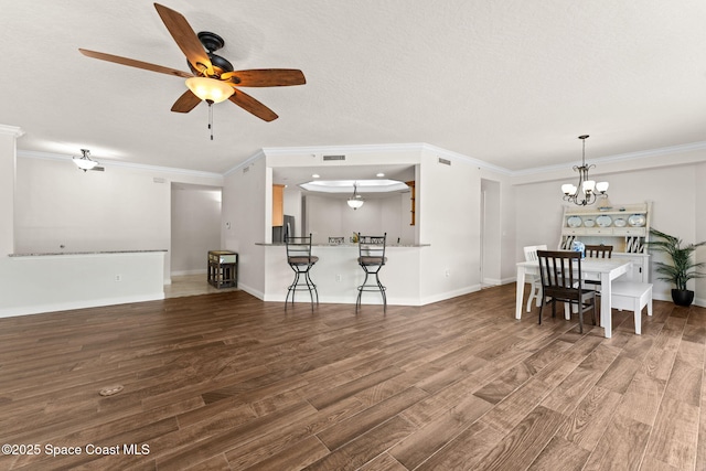 1 Eighth Ave Unit 1201, Indialantic, FL 32903 - living room with wood finished floors, a chandelier, a ceiling fan, and ornamental molding