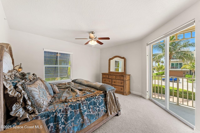 1 Eighth Ave Unit 1201, Indialantic, FL 32903 - bedroom with access to outside, light colored carpet, and ceiling fan