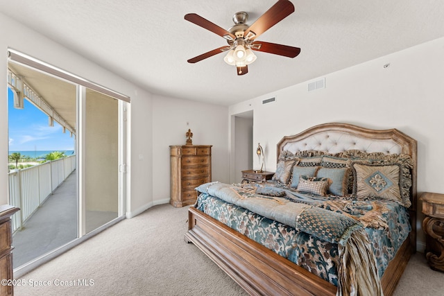 1 Eighth Ave Unit 1201, Indialantic, FL 32903 - bedroom with access to exterior, carpet floors, and a ceiling fan