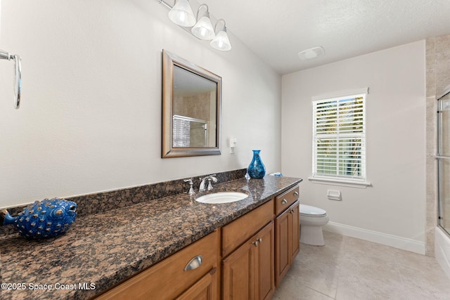 1 Eighth Ave Unit 1201, Indialantic, FL 32903 - full bathroom featuring vanity, tile patterned flooring, and combined bath / shower with glass door