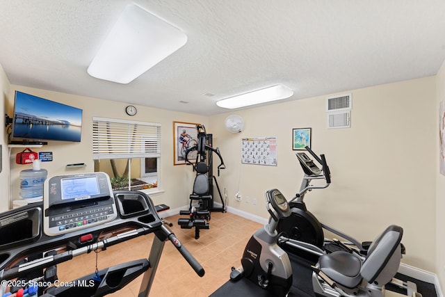 1 Eighth Ave Unit 1201, Indialantic, FL 32903 - exercise area with a textured ceiling and light tile patterned floors