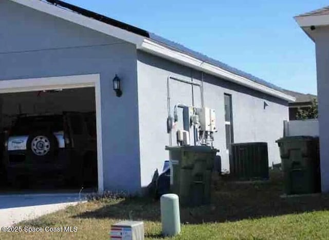 837 Cambridge Dr, Winter Haven, FL 33881 - view of home's exterior with stucco siding and a garage