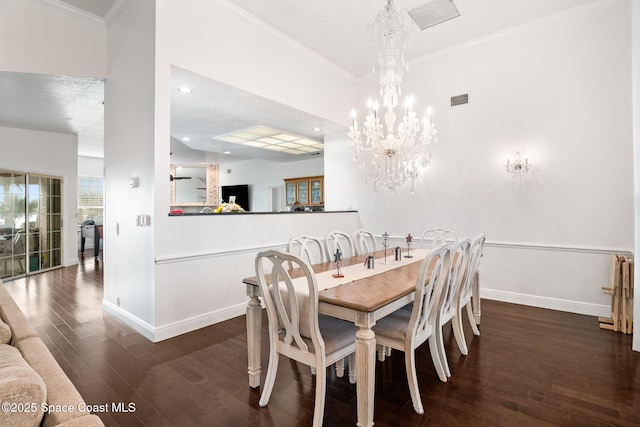 405 Lake View Ln, Grant-Valkaria, FL 32909 - dining space featuring wood finished floors, a chandelier, crown molding, and recessed lighting