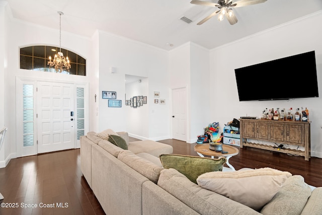 405 Lake View Ln, Grant-Valkaria, FL 32909 - living area featuring a chandelier, a towering ceiling, ornamental molding, ceiling fan, and dark wood finished floors