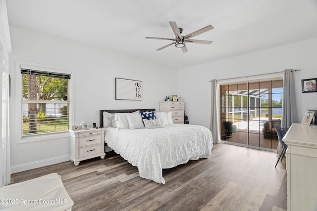 405 Lake View Ln, Grant-Valkaria, FL 32909 - bedroom with access to exterior, wood finished floors, and a ceiling fan
