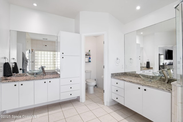 405 Lake View Ln, Grant-Valkaria, FL 32909 - full bathroom with two vanities, recessed lighting, and tile patterned flooring
