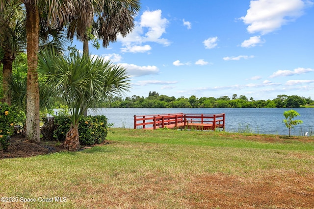 405 Lake View Ln, Grant-Valkaria, FL 32909 - dock area featuring a water view and a lawn