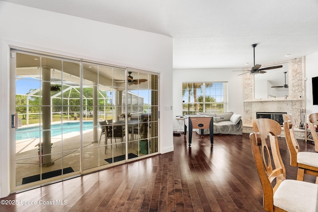 405 Lake View Ln, Grant-Valkaria, FL 32909 - dining area featuring hardwood / wood-style floors, a fireplace, and a ceiling fan