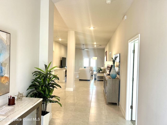 1225 Kylar Dr NE, Palm Bay, FL 32907 - corridor with light tile patterned floors and recessed lighting